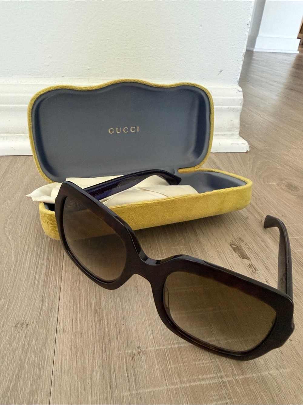 Gucci Women’s Black Frame Sunglasses with Brown Gradient Lenses
